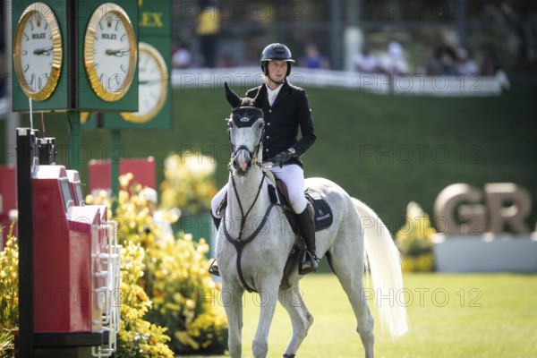 Martin Fuchs of Switzerland and riding Leone Jei compete in the first round of the 1.60m CPKC International during the Spruce Meadows Masters, presented by Rolex, in Calgary, Alberta, Canada, North America