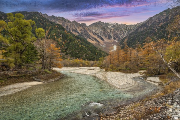 Nature landscape at Kamikochi Japan, autumn foliage season with pond and mountain
