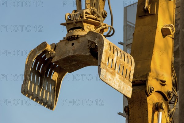 Excavators on a building site demolishing a house, creating space for new flats and living space Austria