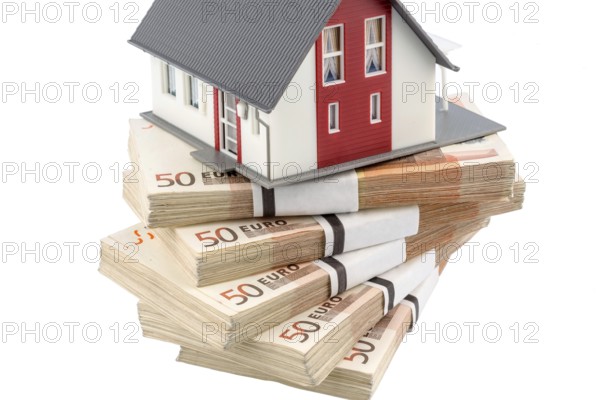 House on euro banknotes, symbolic photo for house purchase, financing, building society savings Austria