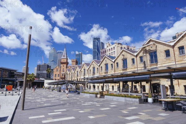 SYDNEY, AUSTRALIA, MARCH 4 2023: Campbells Cove at the Rocks with surrounding harbour on a warm autumn day in Sydney, Australia, Oceania