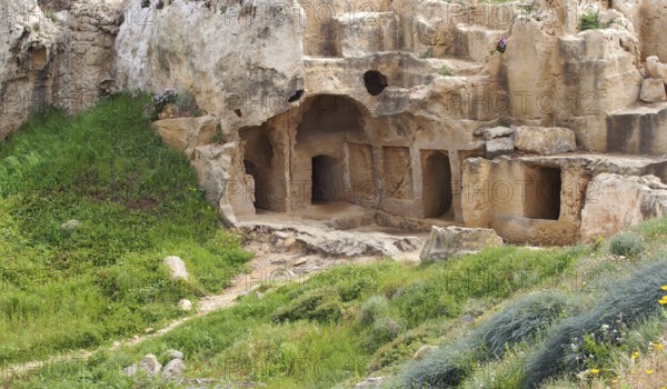 Carved chambers and steps cut into rock in the tomb of the kings area of paphos cyprus