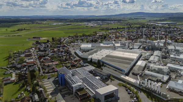 Industrial building scene next to a cityscape with a wide view of fields and sky, Mitterteich, Upper Palatinate, Bavaria, Germany, Europe