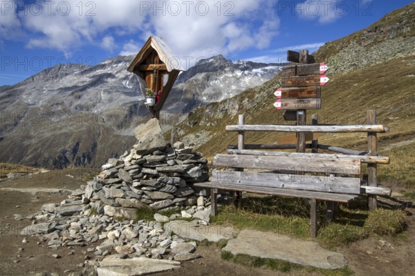 Wayside shrine with bench in the mountains of South Tyrol, Italy, Europe