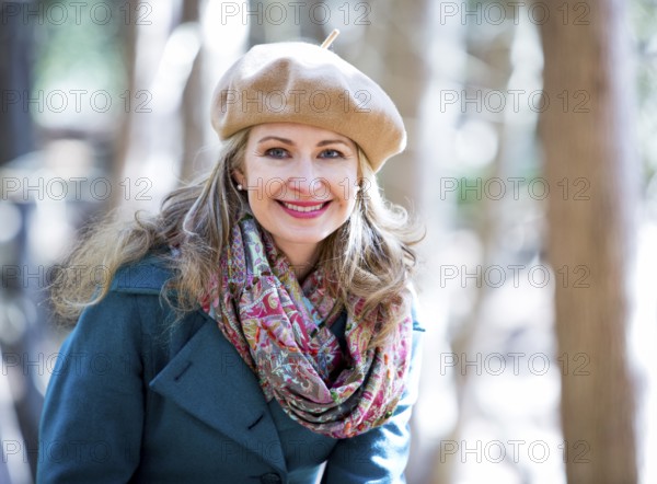 Blond casual woman happy outdoors in the woods, Toronto, Canada, North America