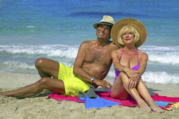 Seniors, couple on the beach in Ibiza