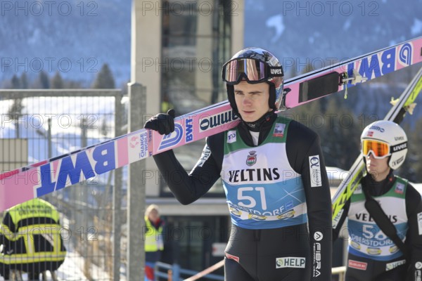 Marius Lindvik (Norway/NOR) on his way to the ski jump during the qualification for the opening ski jumping event of the 73rd Four Hills Tournament in Oberstdorf, Oberstdorf, Germany / Germany