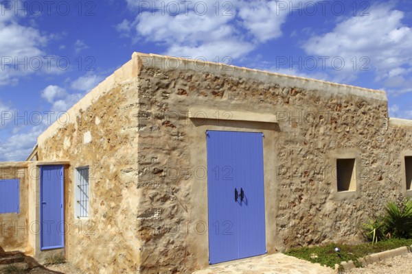 Stone house masonry blue sky door windows Formentera Balearic