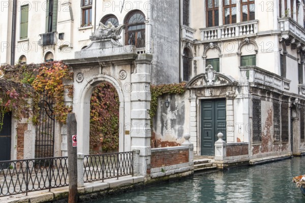 Entrance of an old baroque Palace in Dorsoduro Quarter, Venice, Italy, Europe