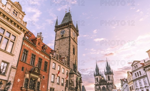 Image with the clock tower and the Church of our Lady before Tyn, at sunrise, in the Old Town Square, in Prague, Czech Republic, Europe