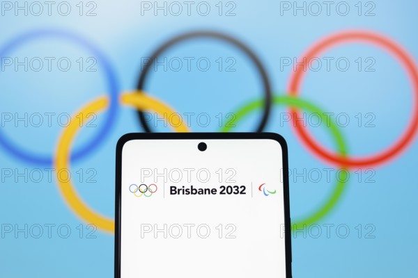 In this photo illustration, the 2032 Summer Olympics Games, Brisbane 2032 logo is displayed on a smartphone screen