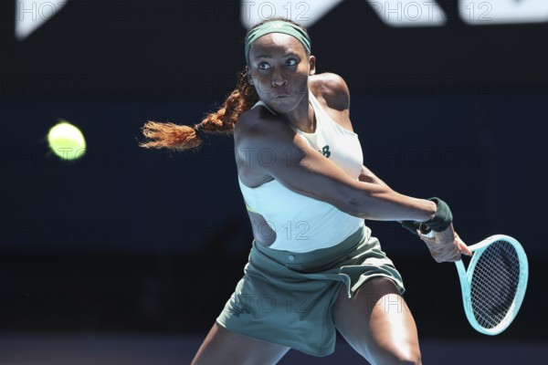 American tennis player Coco Gauff (USA) playing a backhand shot at the Australian Open 2025 tournament, Melbourne Park, Melbourne, Victoria, Australia, Oceania