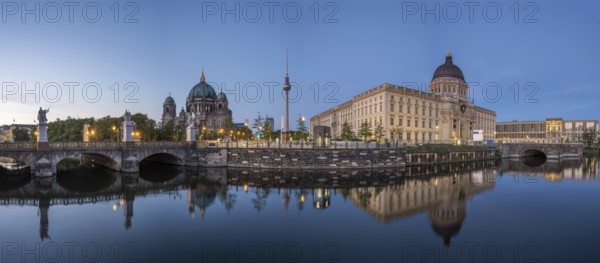 Panorama of Berlin Cathedral, the famous television tower and the rebuilt City Palace at dusk