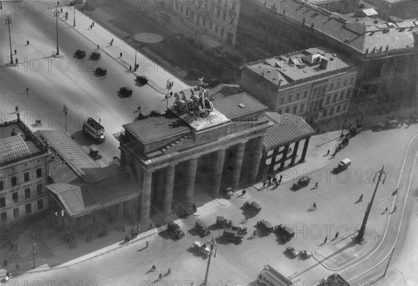 Berlin in the 1930s. An aerial view of Brandenburger gate on december 15 1933. An 18th- century neoclassical monument and one of the best-known landmarks of Germany located in the centre of Berlin. After World War II the Brandenburger gate was located in the soviet occupation zone and the Berlin wall was constructed directly next to it. The gaten is now considered a symbol of European unity and peace. The gate is the monumental entry to the boulevard Under den Linden