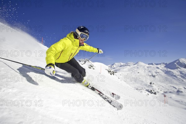 Skier in action, blonde woman, 25, 30, years, downhill skiing, Austria, Europe