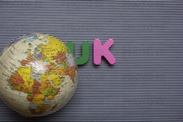 Abbreviation of united kingdom UK on wood background