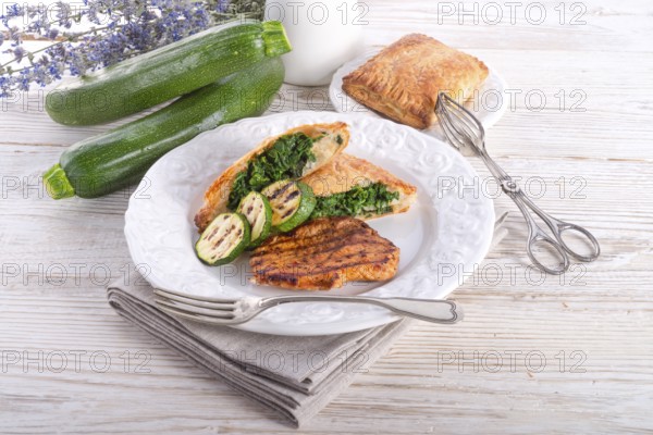 Grilled steaks with puff pastry bag and zucchini