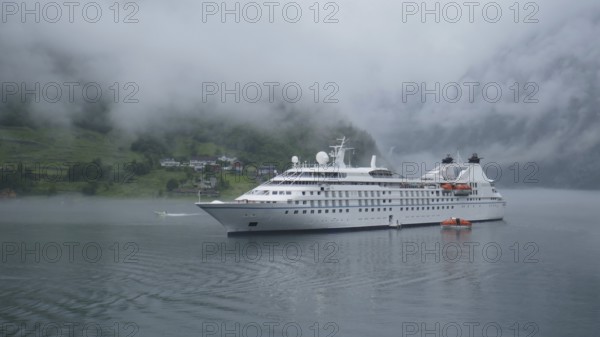 Cruise ship in the fog. Geirangerfjord, Norway, Europe