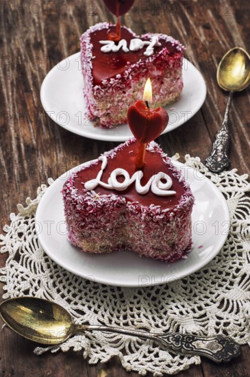 Cake with fruit filling in the shape of heart with the inscription love