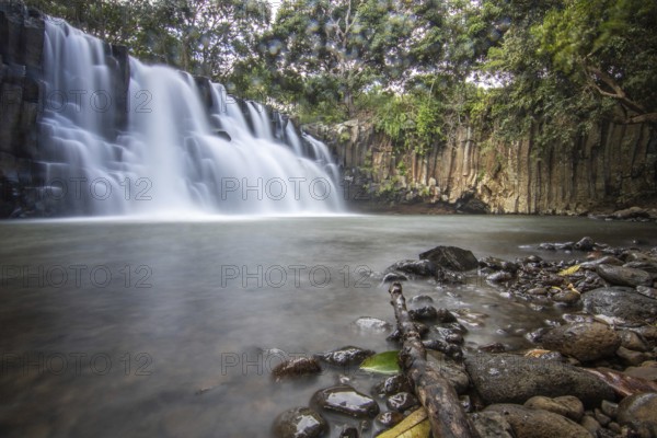 The waterfall is a 10 metre high waterfall that cascades over basal pillars into a basin. Tropical nature and landscape at Rochester Falls, Mauritius, Africa