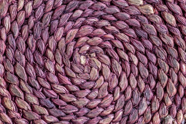 Braided raffia coaster as a background