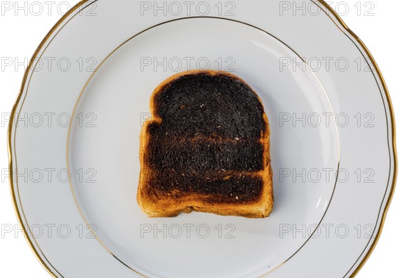 Toast was burnt during toasting. Burnt slices of toast at breakfast. Austria
