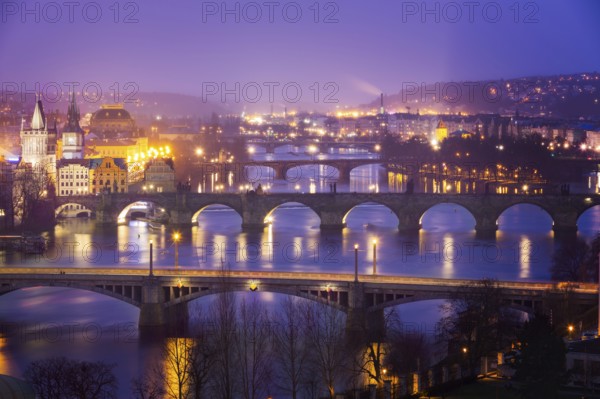 Vltava (Moldau) River at Prague with Charles Bridge at dusk, Czech Republic, Europe
