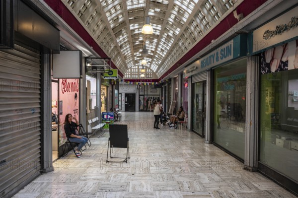 Brussels Old Town, Belgium, 10 28 2022, Art deco interior design with nail shops of the central gallery, Europe