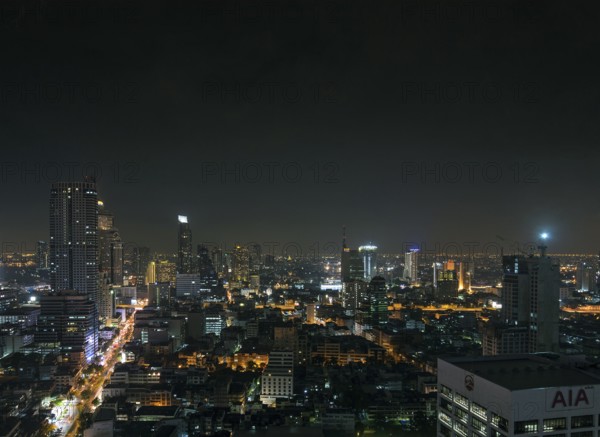 Modern buildings in silom area of central bangkok thailand at night