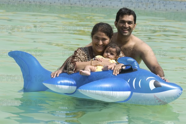 Family enjoying in swimming pool at Uttan near Bhayander west Maharashtra India Asia MR 721W