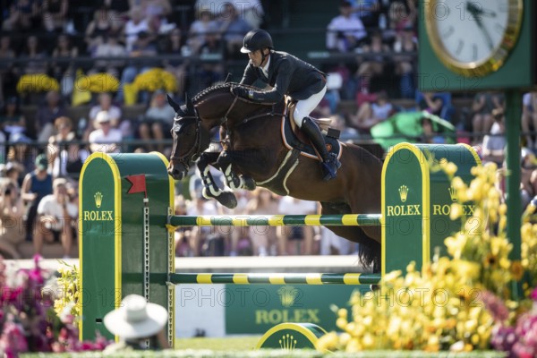 Harrie Smolders of The Netherlands and riding Uricas V/D Kattevennen compete in the first round of the 1.60m CPKC International during the Spruce Meadows Masters, presented by Rolex, in Calgary, Alberta, Canada, North America