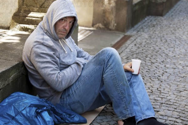 An unemployed beggar is homeless and hungry Austria