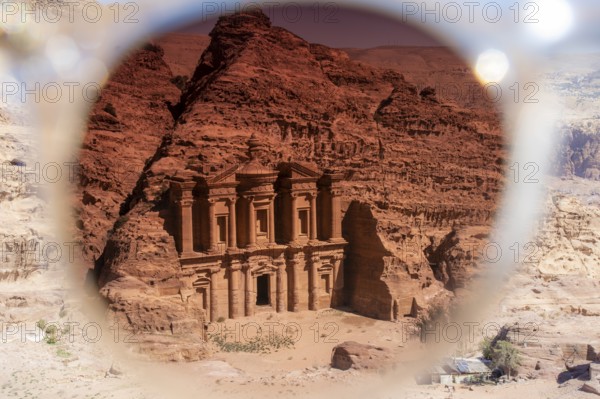 View on the monastery of Petra through the tainted glass of a sunglasses. Creative image