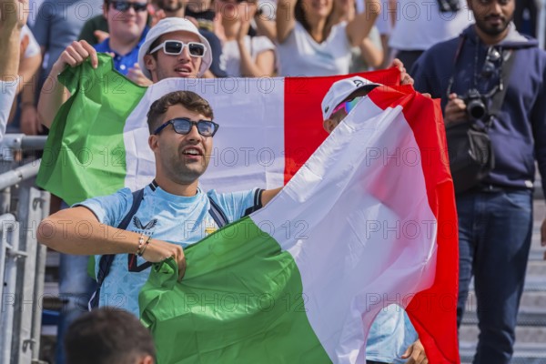 Jul 28, 2024-Paris, FRA, Fans show their support for their favorite players, showing national pride and excitement during the Preliminary Phase, Pool B Mens Beach Volleyball match at the Stade Tour Eiffel stadium during the 2024 Paris Summer Olympics in Paris, France, Europe