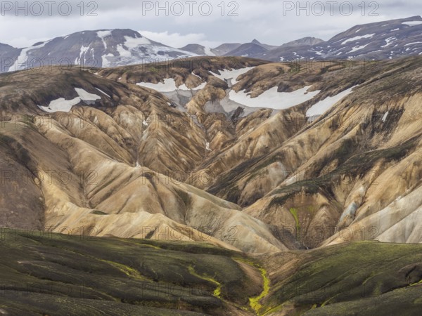 Rhyolite mountains, lava scree, Landmannalaugar, mountain peaks with snow, Fjallabak nature reserve, highlands, Iceland, Europe
