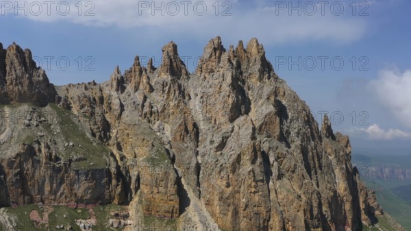 Aerial view on Naujiza or Mother-in-law teeth mountain with fantastic cliffs in Kabardino-Balkaria, Caucasus, Russia, Europe