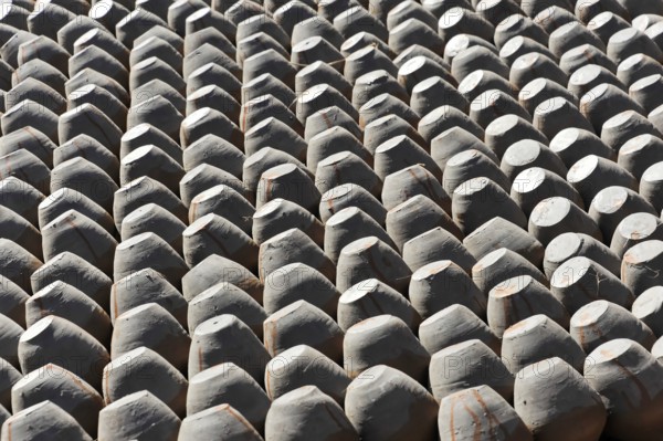 Ordered stacks of clay pots create a repeating geometric pattern, Kathmandu Valley. Kathmandu, Nepal, Asia
