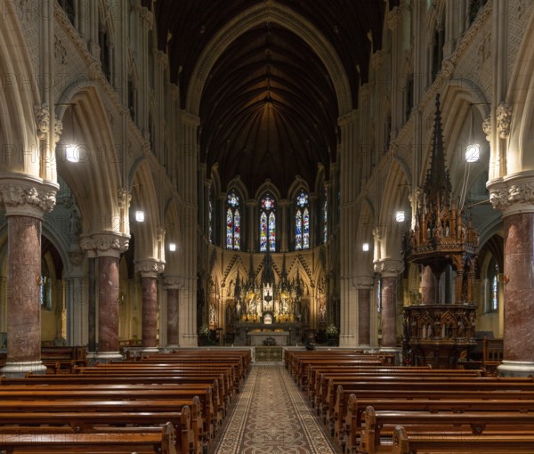 Cobh, Ireland, 15 August, 2022: view of the central nave and altar with the elegant wooden pulpit in the Cobh Cathedral, Europe