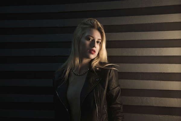 Beautiful girl, blonde posing in the Studio