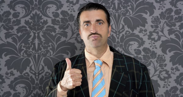 Nerd businessman gesturing ok positive with hand over retro wallpaper