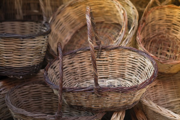 Empty wicker baskets are seein a market place