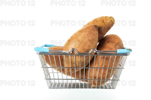 Shopping basket with sweet potatoes isolated over white background