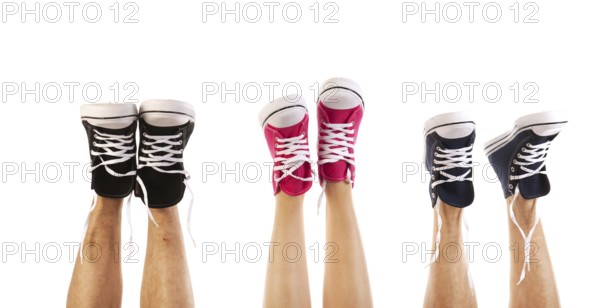 Feet in basketball shoes isolated over white background