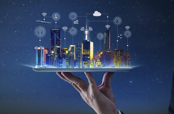 Waiter hand holding an empty digital tablet with Smart city with smart services and icons, internet of things, networks and augmented reality concept, night scene
