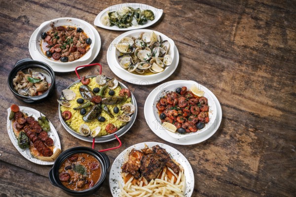 Mixed portuguese traditional rustic tapas famous food selection on wood table
