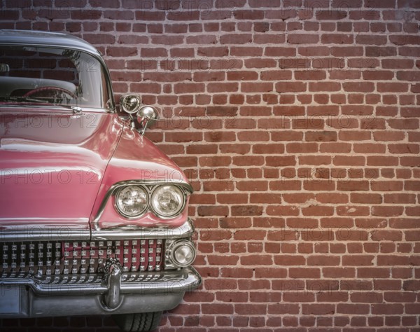 Classic Vintage 50s American Car Against A Red Brick Wall With Copy Spce