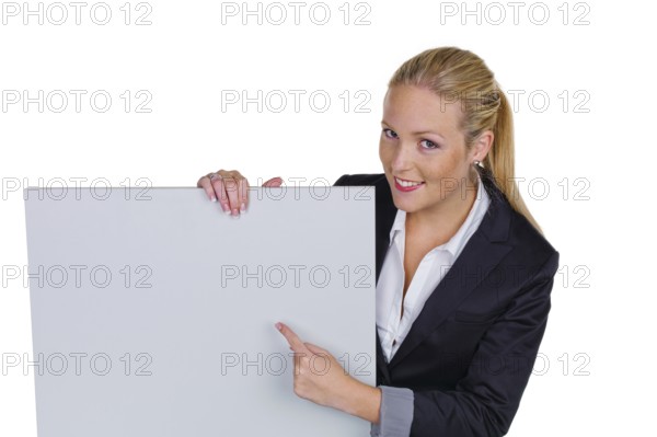 A young pretty woman in business attire with a blank billboard. Austria