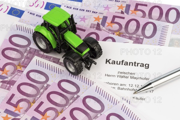 The purchase contract for a new tractor. With euro money and biros