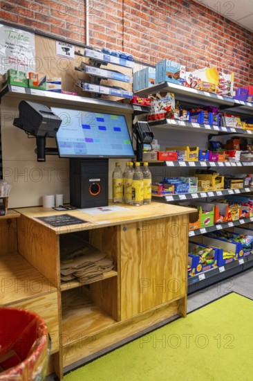 Digital checkout and shelves full of products in a modern supermarket, Tante M, self-service shop, Enzklösterle, Calw district, Black Forest, Germany, Europe