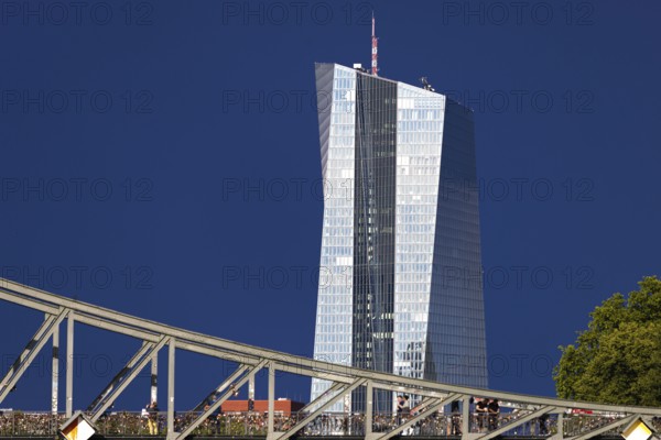 After a storm, the glass façade of the European Central Bank (ECB) shines in the sunlight, Frankfurt am Main, Hesse, Germany, Europe